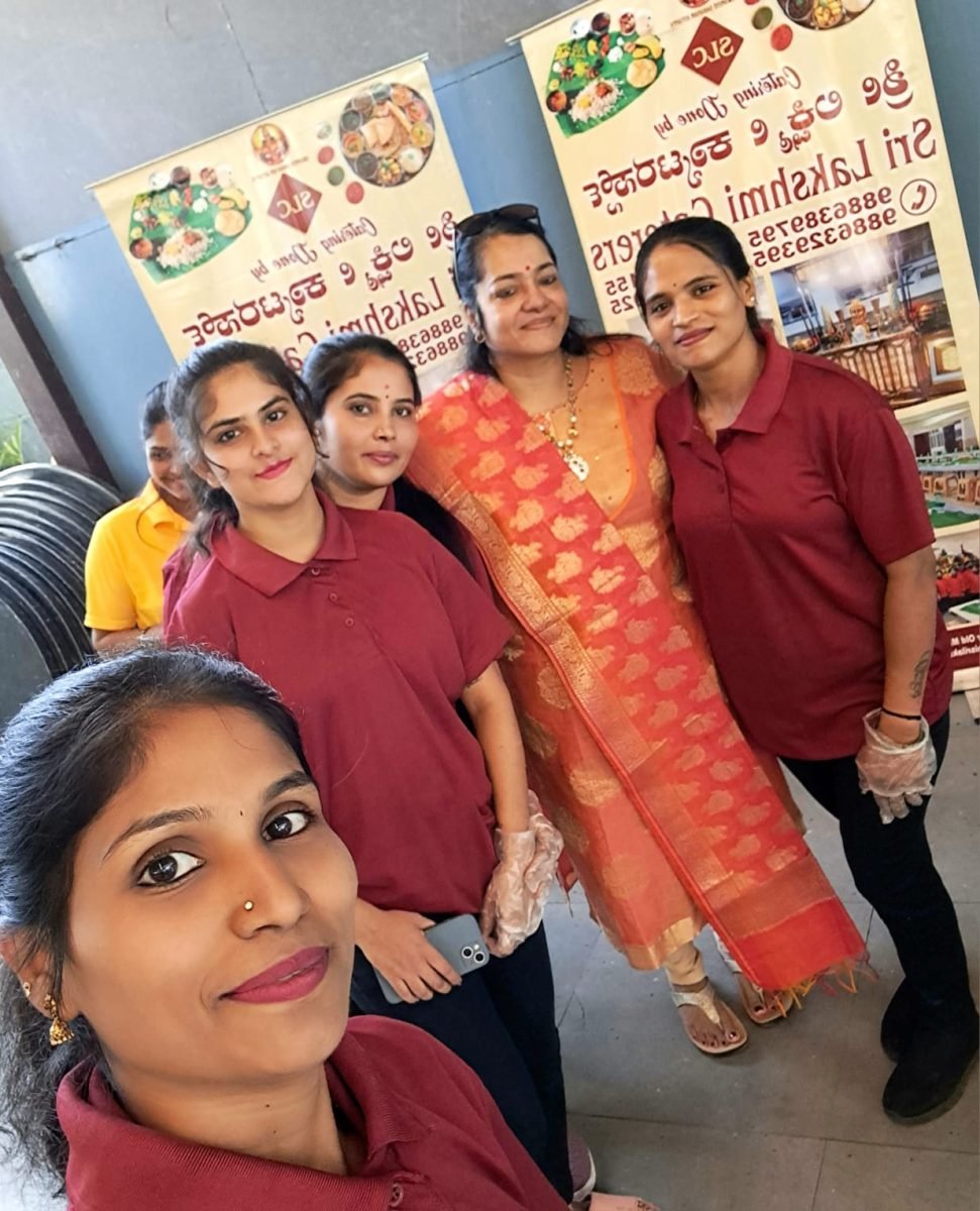 Sri Lakshmi Caterers service team in branded uniforms at a Bangalore event