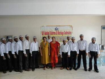 Full Sri Lakshmi Caterers service crew assembled before an event