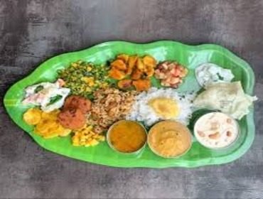 Festive Brahmin banana leaf feast laid out course by course
