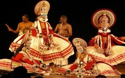 Kathakali dancer in full costume at a Kerala themed catered event