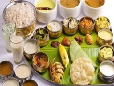 Wide Kerala sadya spread with rice, curries and payasam