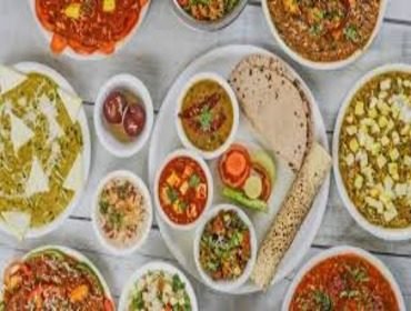 Full North Indian dish spread laid out on a catering buffet