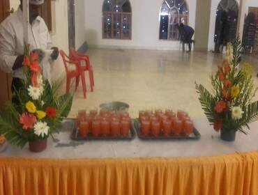 Decorated welcome drink station set up at the entrance of an event