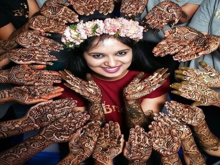 Bridal mehendi applied in detail on the bride's hands
