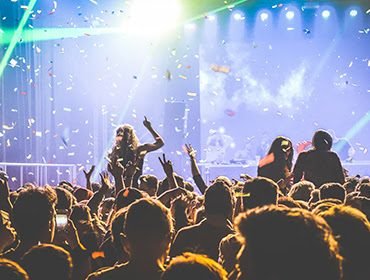 Students gathered at a college event stage during a catered function
