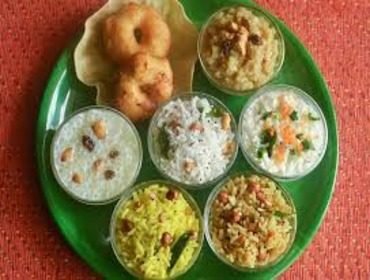 Festive platter of sweets and savouries served at a seemantham