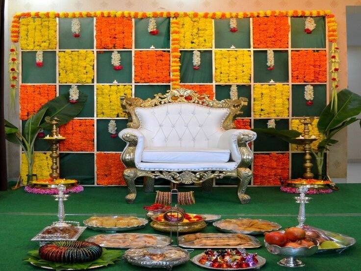 Seemantham stage decorated with fresh marigold garlands