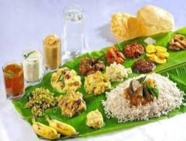 Grand wedding feast served on banana leaves to seated guests