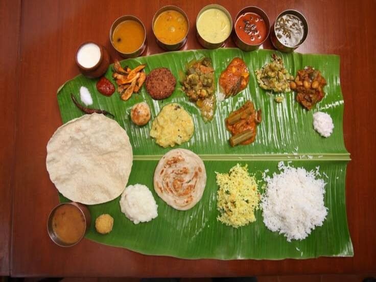 Complete wedding meal laid out on a banana leaf