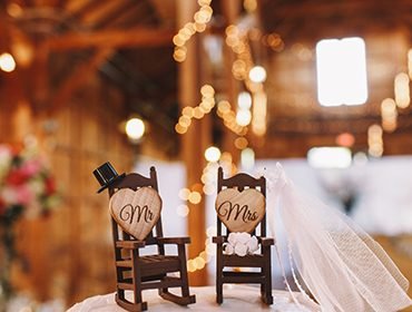 Mr and Mrs decorated chairs set up for the wedding couple